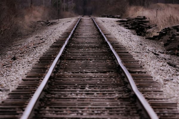 Desolate train tracks at dusk